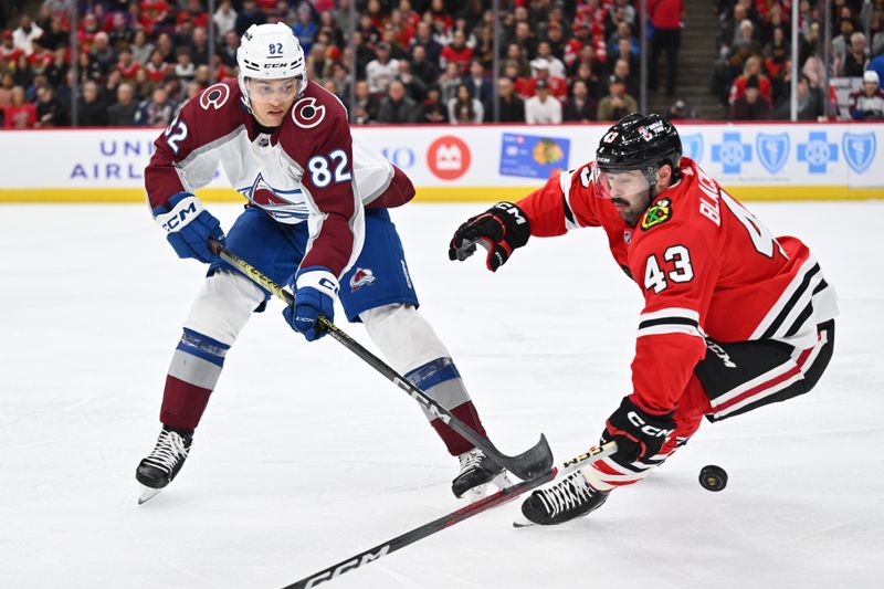 Dec 19, 2023; Chicago, Illinois, USA; Colorado Avalanche defenseman Caleb Jones (82) passes off the puck as Chicago Blackhawks forward Colin Blackwell (43) defends in the first period at United Center. Mandatory Credit: Jamie Sabau-USA TODAY Sports