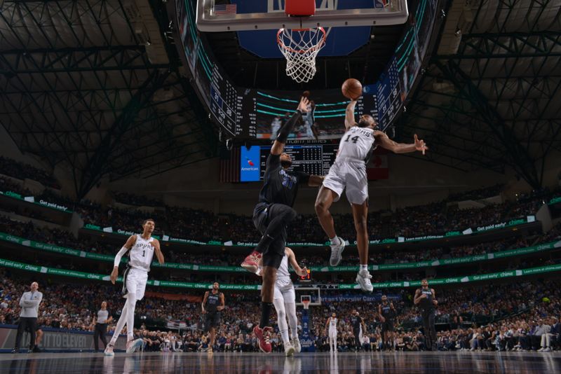 DALLAS, TX - FEBRUARY 14: Blake Wesley #14 of the San Antonio Spurs dunks the ball during the game against the Dallas Mavericks on February 14, 2024 at the American Airlines Center in Dallas, Texas. NOTE TO USER: User expressly acknowledges and agrees that, by downloading and or using this photograph, User is consenting to the terms and conditions of the Getty Images License Agreement. Mandatory Copyright Notice: Copyright 2024 NBAE (Photo by Glenn James/NBAE via Getty Images)