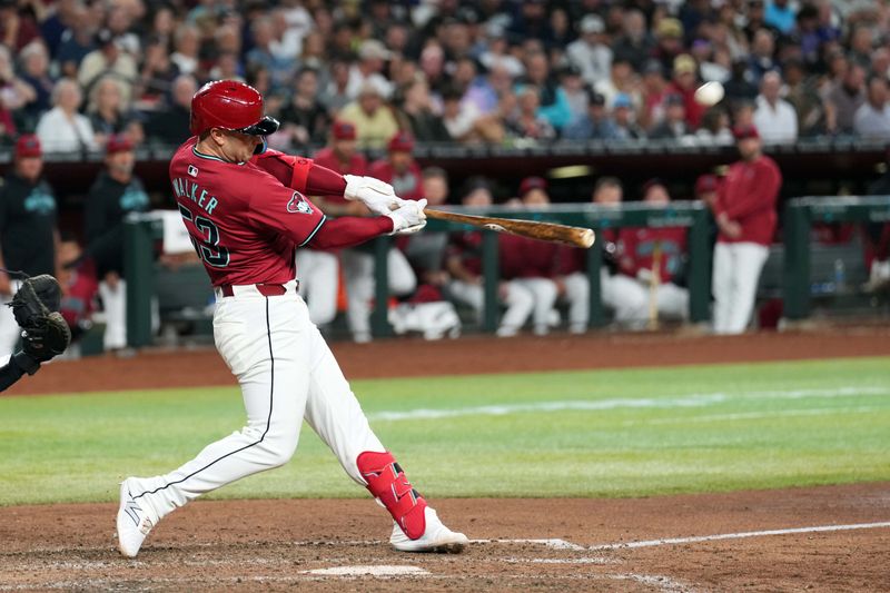 Apr 2, 2024; Phoenix, Arizona, USA; Arizona Diamondbacks first baseman Christian Walker (53) hits a three run home run against the New York Yankees during the seventh inning at Chase Field. Mandatory Credit: Joe Camporeale-USA TODAY Sports