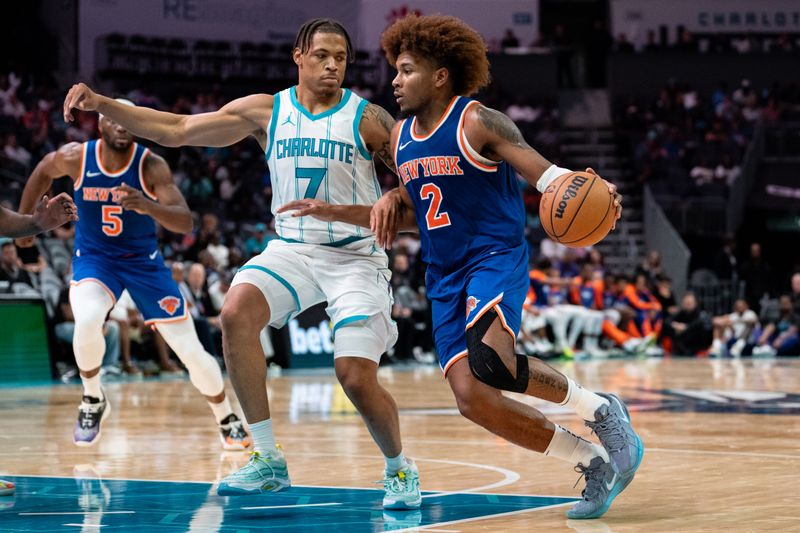 CHARLOTTE, NORTH CAROLINA - OCTOBER 06: Keyontae Johnson #7 of the Charlotte Hornets guards Miles McBride #2 of the New York Knicks in the fourth quarter during a preseason game at Spectrum Center on October 06, 2024 in Charlotte, North Carolina. NOTE TO USER: User expressly acknowledges and agrees that, by downloading and or using this photograph, User is consenting to the terms and conditions of the Getty Images License Agreement. (Photo by Jacob Kupferman/Getty Images)