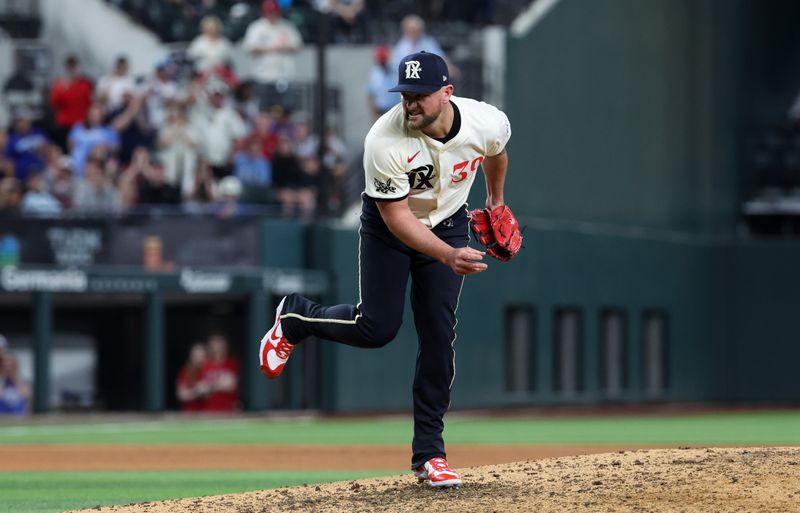 Apr 26, 2024; Arlington, Texas, USA;  Texas Rangers pitcher Kirby Yates (39) throws during the ninth inning against the Cincinnati Reds at Globe Life Field. Mandatory Credit: Kevin Jairaj-USA TODAY Sports