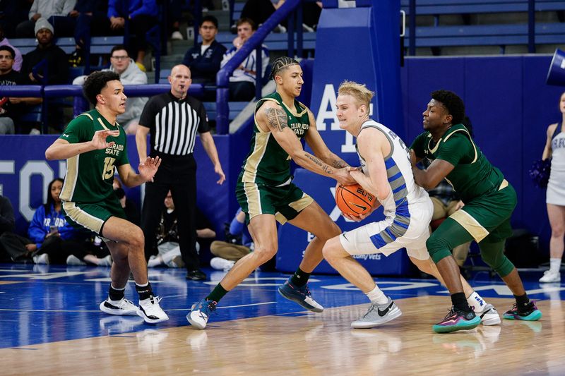 Mar 9, 2024; Colorado Springs, Colorado, USA; Air Force Falcons forward Rytis Petraitis (31) is fouled by Colorado State Rams guard Nique Clifford (10) as guard Jalen Lake (15) and guard Isaiah Stevens (4) defend in the first half at Clune Arena. Mandatory Credit: Isaiah J. Downing-USA TODAY Sports