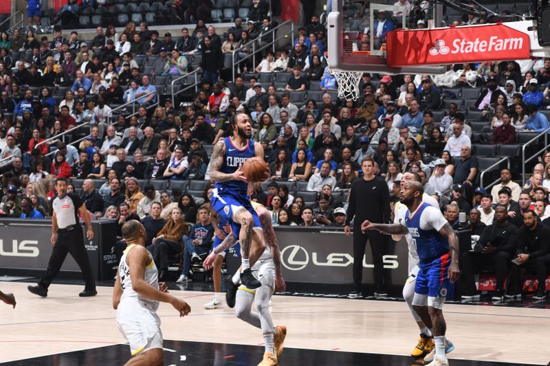 LOS ANGELES, CA - APRIL 12: Amir Coffey #7 of the LA Clippers drives to the basket during the game against the Utah Jazz on April 12, 2024 at Crypto.Com Arena in Los Angeles, California. NOTE TO USER: User expressly acknowledges and agrees that, by downloading and/or using this Photograph, user is consenting to the terms and conditions of the Getty Images License Agreement. Mandatory Copyright Notice: Copyright 2024 NBAE (Photo by Adam Pantozzi/NBAE via Getty Images) <p><br/></p>