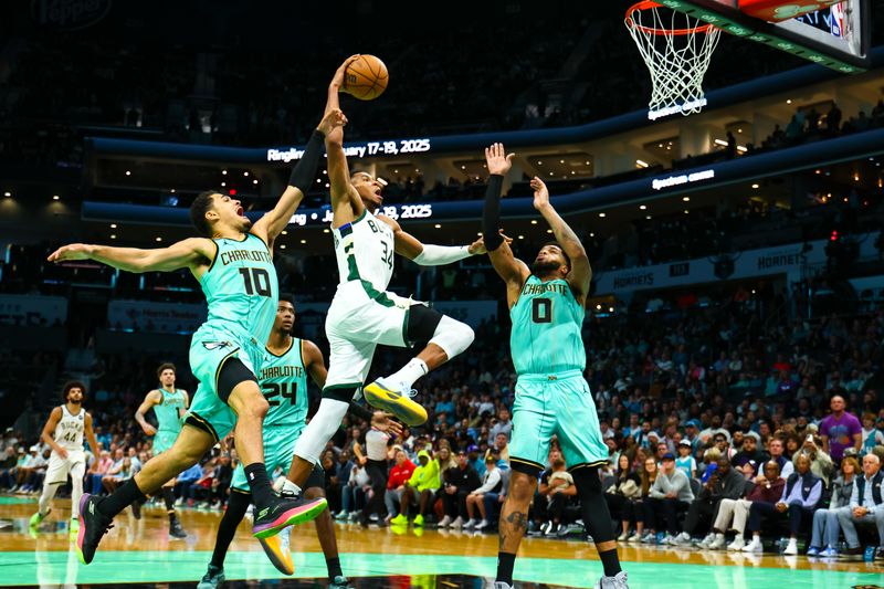 CHARLOTTE, NORTH CAROLINA - NOVEMBER 16: Giannis Antetokounmpo #34 of the Milwaukee Bucks dunks the ball during the second half of a basketball game against the Charlotte Hornets at Spectrum Center on November 16, 2024 in Charlotte, North Carolina. NOTE TO USER: User expressly acknowledges and agrees that, by downloading and or using this photograph, User is consenting to the terms and conditions of the Getty Images License Agreement. (Photo by David Jensen/Getty Images)