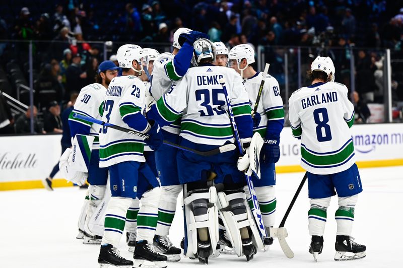 Oct 27, 2022; Seattle, Washington, USA; The Vancouver Canucks celebrate after defeating the Seattle Kraken at Climate Pledge Arena. Vancouver defeated Seattle 5-4. Mandatory Credit: Steven Bisig-USA TODAY Sports