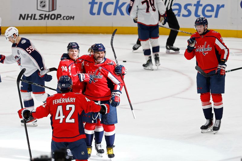 Nov 24, 2025; Washington, District of Columbia, USA; Washington Capitals defenseman John Carlson (74) /celebrates with Capitals left wing Alex Ovechkin (8) after scoring a goal against the Columbus Blue Jackets during the second period at Capital One Arena. Mandatory Credit: Geoff Burke-Imagn Images