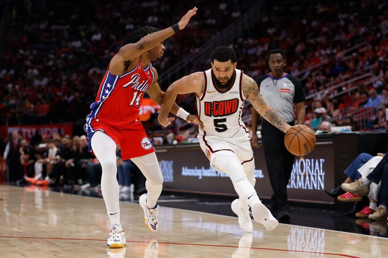 HOUSTON, TEXAS - MARCH 17: Fred VanVleet #5 of the Houston Rockets drives against Ricky Council IV #14 of the Philadelphia 76ers in the second half at Toyota Center on March 17, 2025 in Houston, Texas.  NOTE TO USER: User expressly acknowledges and agrees that, by downloading and/or using this photograph, user is consenting to the terms and conditions of the Getty Images License Agreement.  (Photo by Tim Warner/Getty Images)