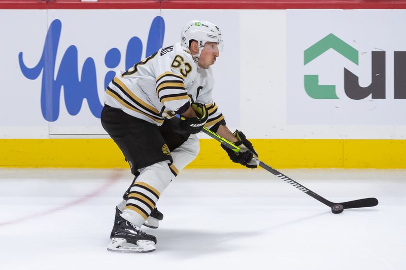 Jan 25, 2024; Ottawa, Ontario, CAN; Boston Bruins left wing Brad Marchand (63) skates with the puck in the third period against the Ottawa Senators at the Canadian Tire Centre. Mandatory Credit: Marc DesRosiers-USA TODAY Sports