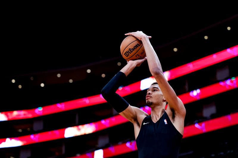 HOUSTON, TEXAS - DECEMBER 11: Victor Wembanyama #1 of the San Antonio Spurs warms up prior to facing the Houston Rockets at Toyota Center on December 11, 2023 in Houston, Texas. NOTE TO USER: User expressly acknowledges and agrees that, by downloading and or using this photograph, User is consenting to the terms and conditions of the Getty Images License Agreement.? (Photo by Carmen Mandato/Getty Images)