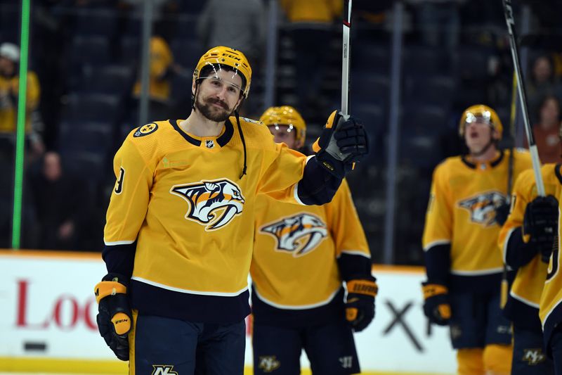 Mar 19, 2024; Nashville, Tennessee, USA; Nashville Predators left wing Filip Forsberg (9) waives to the fans after a win against the San Jose Sharks at Bridgestone Arena. Mandatory Credit: Christopher Hanewinckel-USA TODAY Sports