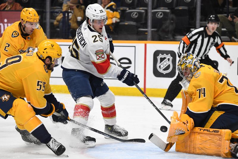 Jan 22, 2024; Nashville, Tennessee, USA; Florida Panthers right wing Mackie Samoskevich (25) has a shot blocked by Nashville Predators goaltender Juuse Saros (74) during the second period at Bridgestone Arena. Mandatory Credit: Christopher Hanewinckel-USA TODAY Sports