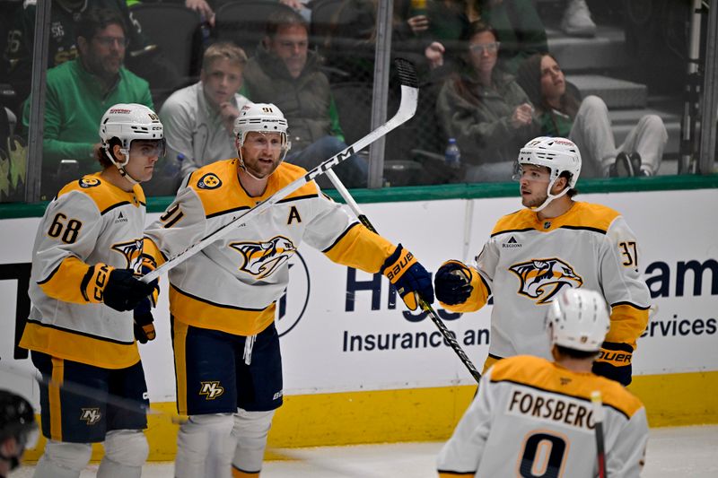 Apr 3, 2025; Dallas, Texas, USA; Nashville Predators left wing Zachary L'Heureux (68) and center Steven Stamkos (91) and defenseman Nick Blankenburg (37) and left wing Filip Forsberg (9) celebrates a goal scored by Stamkos against the Dallas Stars during the second period at the American Airlines Center. Mandatory Credit: Jerome Miron-Imagn Images