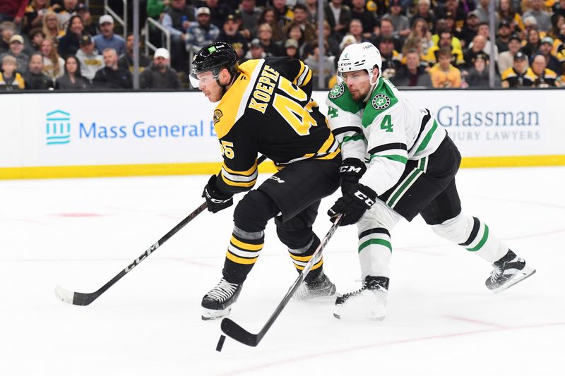 Oct 24, 2024; Boston, Massachusetts, USA;  Dallas Stars defenseman Miro Heiskanen (4) deflects the puck away from Boston Bruins left wing Cole Koepke (45) during the first period at TD Garden. Mandatory Credit: Bob DeChiara-Imagn Images