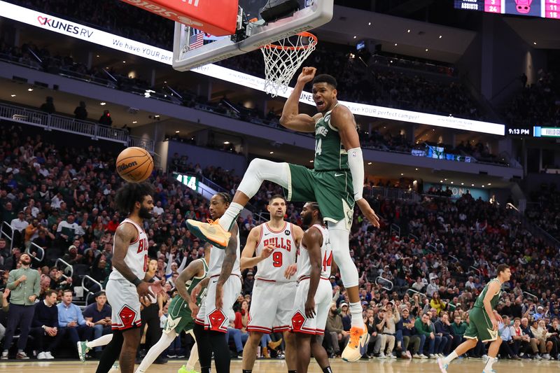 MILWAUKEE, WISCONSIN - DECEMBER 11: Giannis Antetokounmpo #34 of the Milwaukee Bucks dunks against the Chicago Bulls during a game at Fiserv Forum on December 11, 2023 in Milwaukee, Wisconsin. NOTE TO USER: User expressly acknowledges and agrees that, by downloading and or using this photograph, User is consenting to the terms and conditions of the Getty Images License Agreement. (Photo by Stacy Revere/Getty Images)