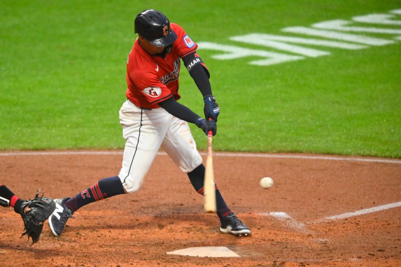 Apr 23, 2024; Cleveland, Ohio, USA; Cleveland Guardians center fielder Tyler Freeman (2) hits an RBI single in the seventh inning against the Boston Red Sox at Progressive Field. Mandatory Credit: David Richard-USA TODAY Sports