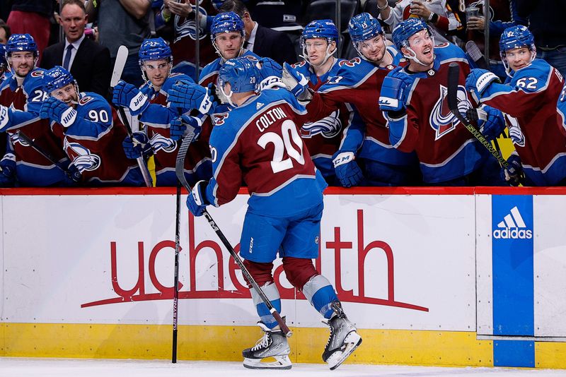 Nov 7, 2023; Denver, Colorado, USA; Colorado Avalanche center Ross Colton (20) celebrates with the bench after his goal in the second period against the New Jersey Devils at Ball Arena. Mandatory Credit: Isaiah J. Downing-USA TODAY Sports