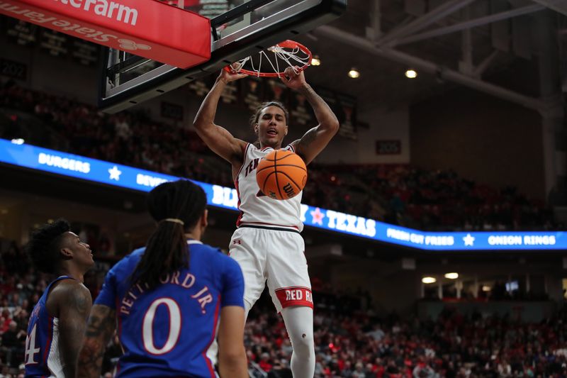 Jan 3, 2023; Lubbock, Texas, USA;  Texas Tech Red Raiders guard Jaylon Tyson (20) slam dunks the ball against Kansas Jayhawks guard Bobby Pettiford Jr (0) in the first half at United Supermarkets Arena. Mandatory Credit: Michael C. Johnson-USA TODAY Sports