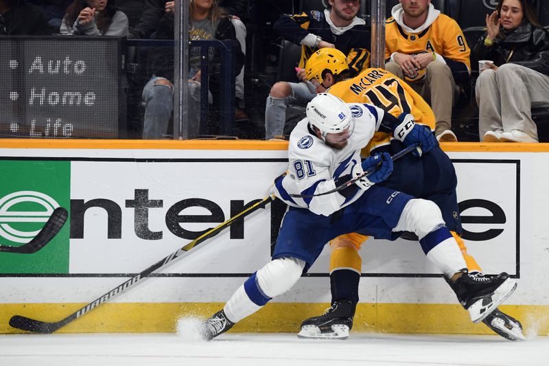 Dec 7, 2023; Nashville, Tennessee, USA; Nashville Predators right wing Michael McCarron (47) is checked by Tampa Bay Lightning defenseman Erik Cernak (81) during the third period at Bridgestone Arena. Mandatory Credit: Christopher Hanewinckel-USA TODAY Sports