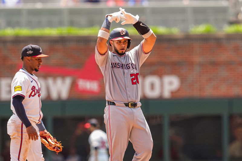 May 15, 2025; Cumberland, Georgia, USA; Washington Nationals catcher Keibert Ruiz (20)  reacts after hitting a double against the Atlanta Braves during the eighth inning at Truist Park. Mandatory Credit: Dale Zanine-Imagn Images
