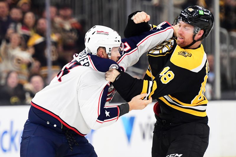 Nov 18, 2024; Boston, Massachusetts, USA;  Boston Bruins left wing Jeffrey Viel (48) fights with Columbus Blue Jackets right wing Mathieu Olivier (24) during the first period at TD Garden. Mandatory Credit: Bob DeChiara-Imagn Images