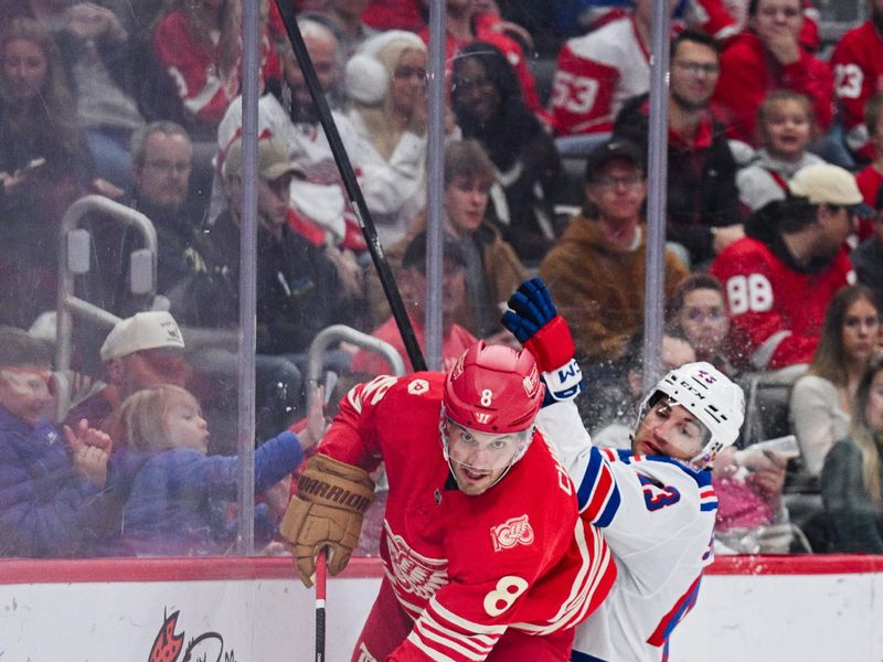 Nov 7, 2025; Detroit, Michigan, USA; Detroit Red Wings defenseman Ben Chiarot (8) and New York Rangers left wing Conor Sheary (43) battle for the puck during the first period at Little Caesars Arena. Mandatory Credit: Tim Fuller-Imagn Images