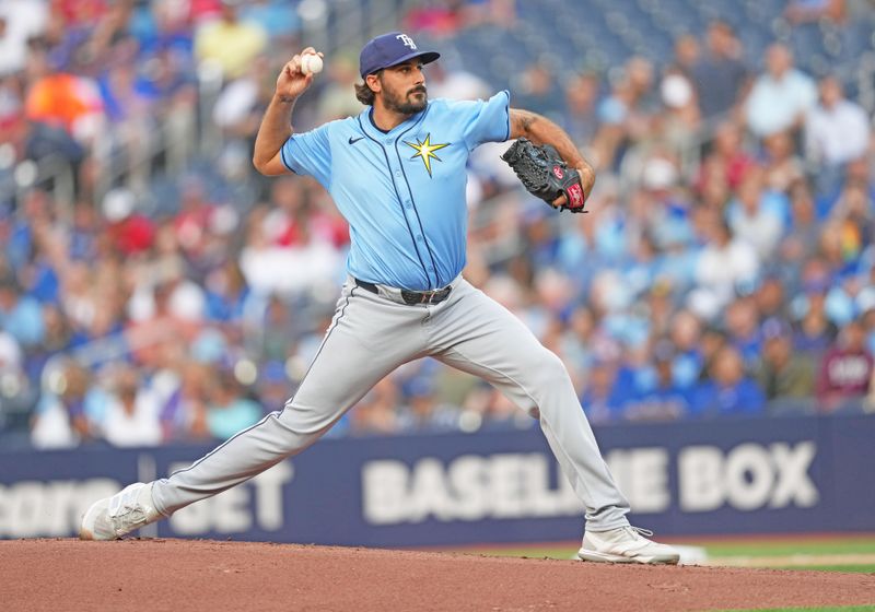 Jul 24, 2024; Toronto, Ontario, CAN; Tampa Bay Rays starting pitcher Zach Eflin (24) throws a pitch against the Toronto Blue Jays during the first inning at Rogers Centre. Mandatory Credit: Nick Turchiaro-USA TODAY Sports