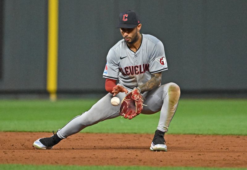 Jun 28, 2024; Kansas City, Missouri, USA;  Cleveland Guardians shortstop Brayan Rocchio (4) fields a ground ball in the eighth inning against the Kansas City Royals at Kauffman Stadium. Mandatory Credit: Peter Aiken-USA TODAY Sports