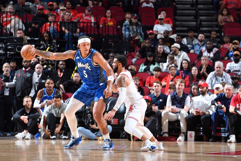 HOUSTON, TX - APRIL 9: Paolo Banchero #5 of the Orlando Magic handles the ball during the game against the Houston Rockets on April 9, 2024 at the Toyota Center in Houston, Texas. NOTE TO USER: User expressly acknowledges and agrees that, by downloading and or using this photograph, User is consenting to the terms and conditions of the Getty Images License Agreement. Mandatory Copyright Notice: Copyright 2024 NBAE (Photo by Logan Riely/NBAE via Getty Images)