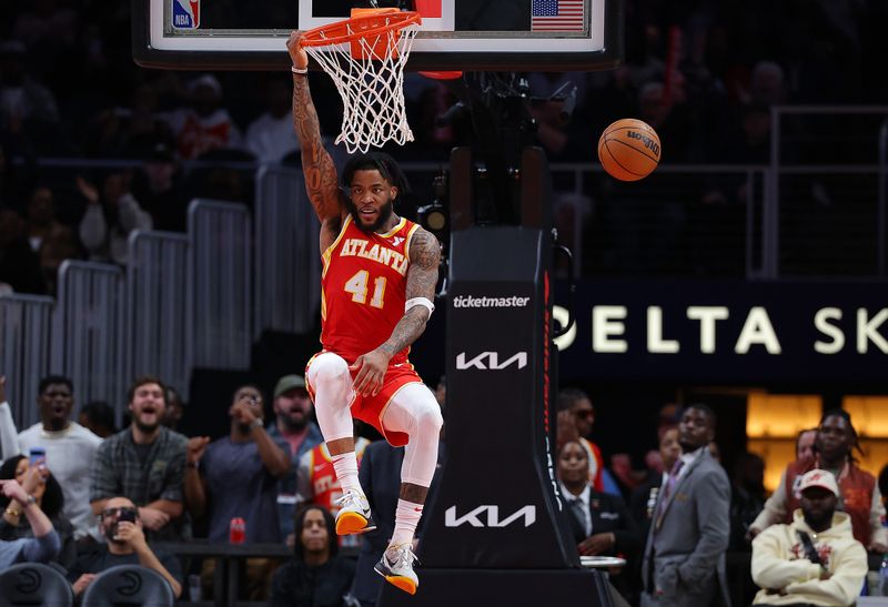 ATLANTA, GEORGIA - FEBRUARY 10:  Saddiq Bey #41 of the Atlanta Hawks dunks against the Houston Rockets during the fourth quarter at State Farm Arena on February 10, 2024 in Atlanta, Georgia.  NOTE TO USER: User expressly acknowledges and agrees that, by downloading and/or using this photograph, user is consenting to the terms and conditions of the Getty Images License Agreement.  (Photo by Kevin C. Cox/Getty Images)