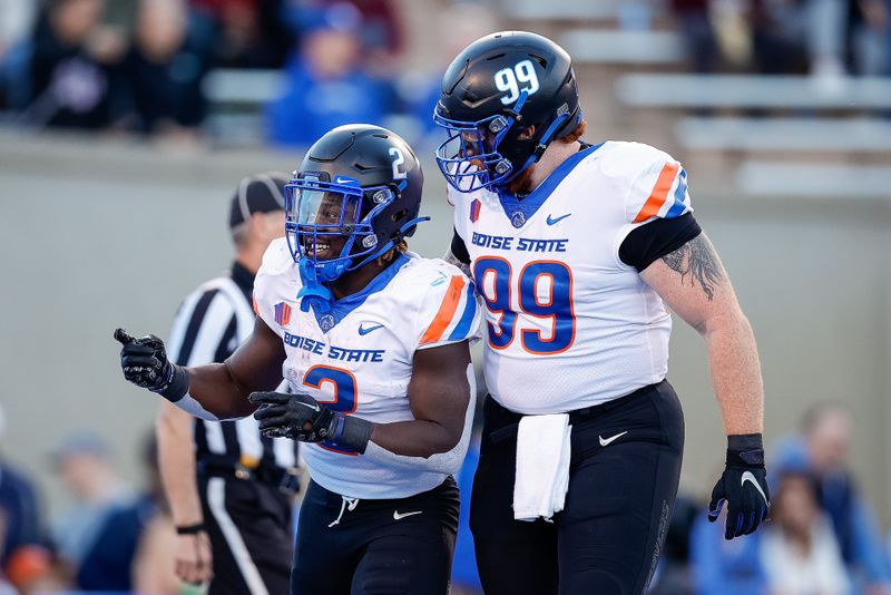 Oct 22, 2022; Colorado Springs, Colorado, USA; Boise State Broncos running back Ashton Jeanty (2) celebrates his touchdown with defensive tackle Scott Matlock (99) in the first quarter against the Air Force Falcons at Falcon Stadium. Mandatory Credit: Isaiah J. Downing-USA TODAY Sports