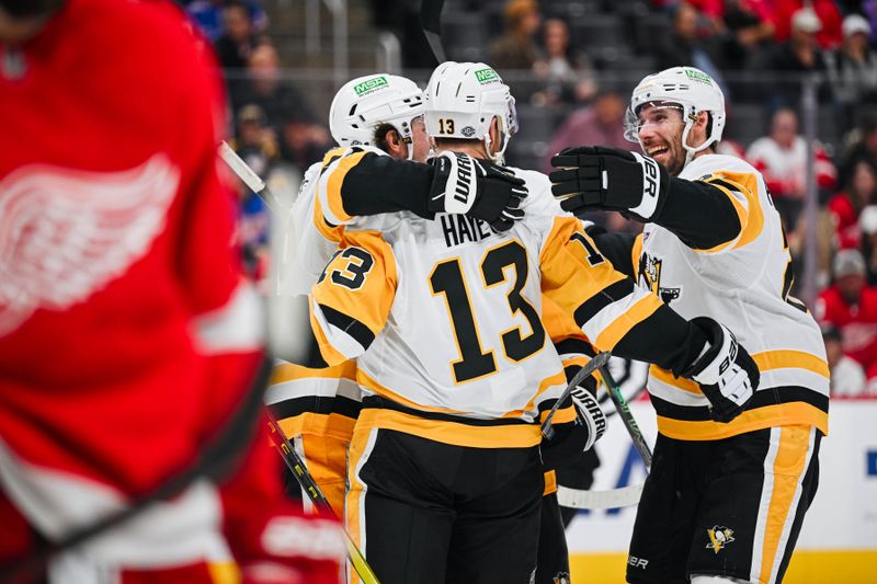 Oct 10, 2024; Detroit, Michigan, USA; Pittsburgh Penguins right wing Kevin Hayes (13) celebrates his goal with teammates during the third period against the Detroit Red Wings at Little Caesars Arena. Mandatory Credit: Tim Fuller-Imagn Images