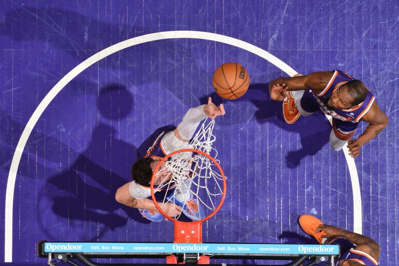 PHOENIX, AZ - FEBRUARY 14:  Jusuf Nurkic #20 of the Phoenix Suns reaches for a rebound during the game against the Detroit Pistons on February 14, 2024 at Footprint Center in Phoenix, Arizona. NOTE TO USER: User expressly acknowledges and agrees that, by downloading and or using this photograph, user is consenting to the terms and conditions of the Getty Images License Agreement. Mandatory Copyright Notice: Copyright 2024 NBAE (Photo by Barry Gossage/NBAE via Getty Images)