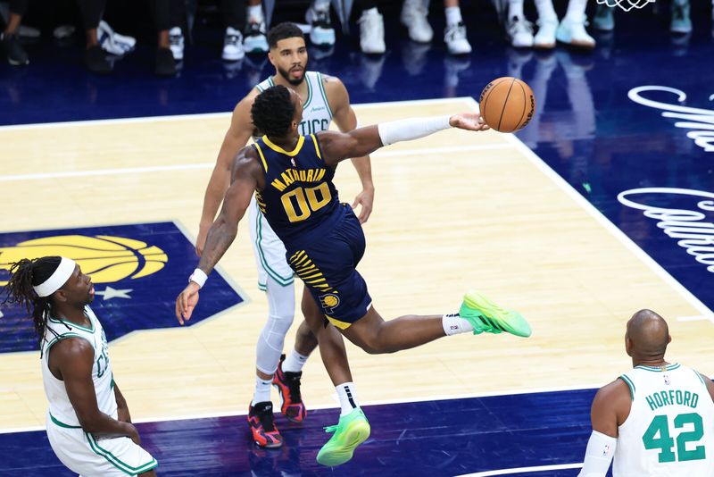 INDIANAPOLIS, INDIANA - OCTOBER 30: Bennedict Mathurin #00 of the Indiana Pacers loses control of the ball while driving to the basket during the second half against the Boston Celtics at Gainbridge Fieldhouse on October 30, 2024 in Indianapolis, Indiana. NOTE TO USER: User expressly acknowledges and agrees that, by downloading and or using this photograph, User is consenting to the terms and conditions of the Getty Images License Agreement. (Photo by Justin Casterline/Getty Images)