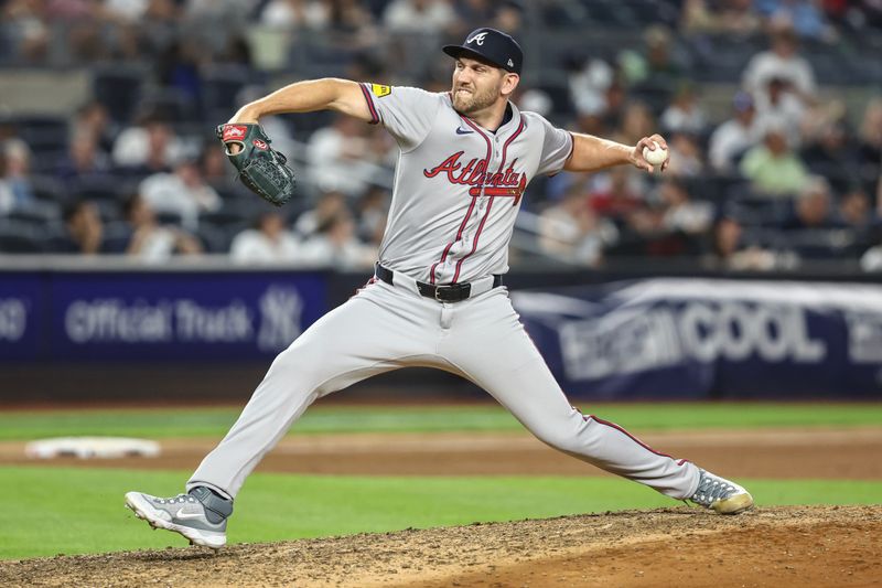 Jun 21, 2024; Bronx, New York, USA; Atlanta Braves pitcher Dylan Lee (52) pitches in the eighth inning against the New York Yankees at Yankee Stadium. Mandatory Credit: Wendell Cruz-USA TODAY Sports