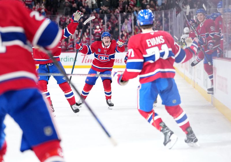 Jan 27, 2026; Montreal, Quebec, CAN; Montreal Canadiens forward Jake Evans (71) celebrates with teammates including forward Cole Caufield (13) after scoring the winning goal against the Vegas Golden Knights during the overtime period at the Bell Centre. Mandatory Credit: Eric Bolte-Imagn Images
