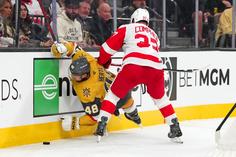 Nov 4, 2025; Las Vegas, Nevada, USA; Detroit Red Wings left wing J.T. Compher (37) checks Vegas Golden Knights center Tomas Hertl (48) during the second period at T-Mobile Arena. Mandatory Credit: Stephen R. Sylvanie-Imagn Images