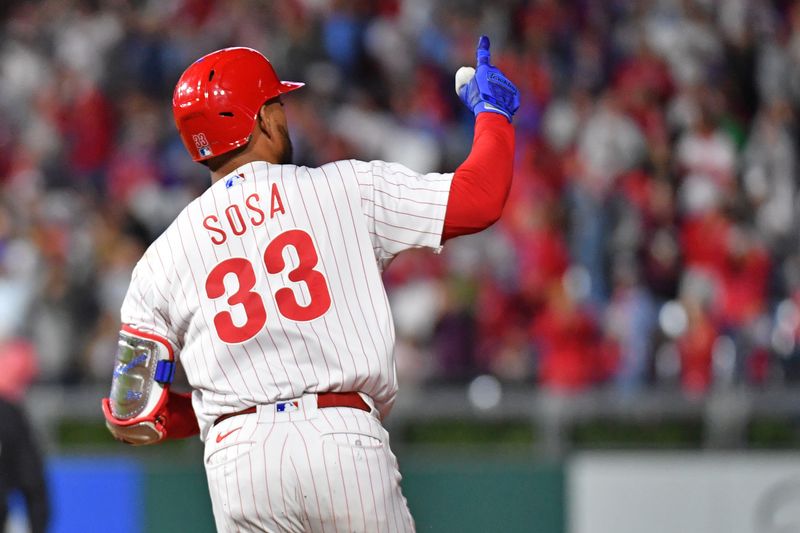 Sep 27, 2023; Philadelphia, Pennsylvania, USA; Philadelphia Phillies third baseman Edmundo Sosa (33) celebrates his home run during the fifth inning against the Pittsburgh Pirates at Citizens Bank Park. Mandatory Credit: Eric Hartline-USA TODAY Sports