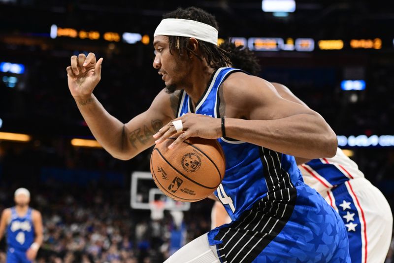 ORLANDO, FLORIDA - JANUARY 19: Wendell Carter Jr. #34 of the Orlando Magic drives to the basket in the second half of a game against the Philadelphia 76ers at Kia Center on January 19, 2024 in Orlando, Florida. NOTE TO USER: User expressly acknowledges and agrees that, by downloading and or using this photograph, User is consenting to the terms and conditions of the Getty Images License Agreement. (Photo by Julio Aguilar/Getty Images)