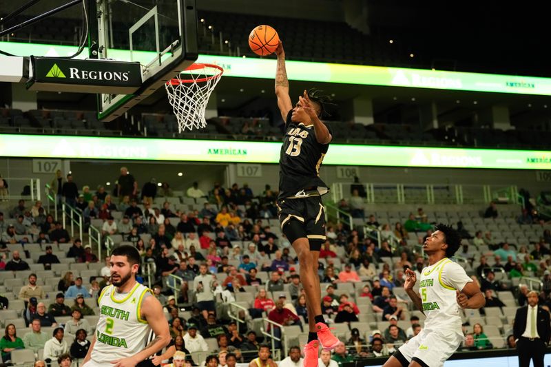 Mar 16, 2024; Fort Worth, TX, USA;  UAB Blazers forward Christian Coleman (13) dunks the ball ahead of South Florida Bulls guard Brandon Stroud (5) during the first half at Dickies Arena. Mandatory Credit: Chris Jones-USA TODAY Sports