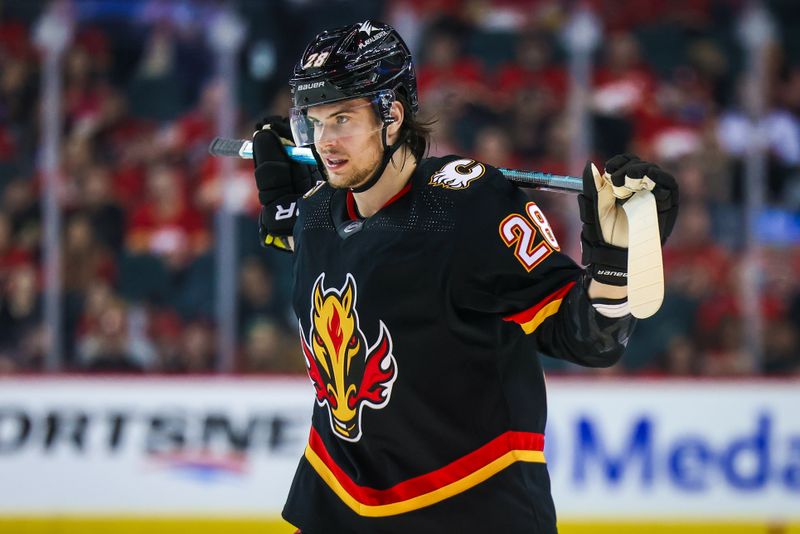 Mar 12, 2024; Calgary, Alberta, CAN; Calgary Flames defenseman Nikita Okhotiuk (28) during the first period against the Colorado Avalanche at Scotiabank Saddledome. Mandatory Credit: Sergei Belski-USA TODAY Sports