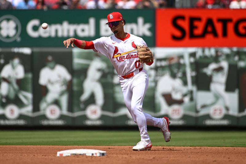 Apr 20, 2024; St. Louis, Missouri, USA; St. Louis Cardinals shortstop Masyn Winn (0) throws to first for an out against the Milwaukee Brewers in the fourth inning at Busch Stadium. Mandatory Credit: Joe Puetz-USA TODAY Sports