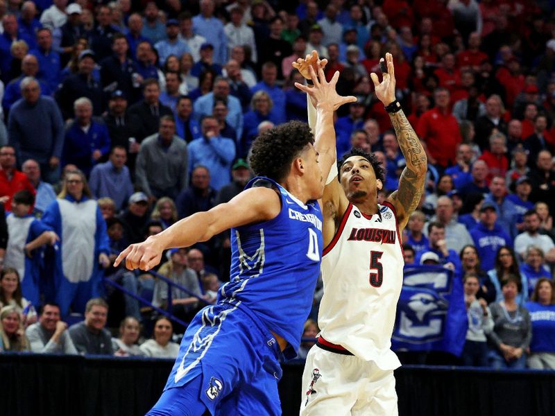 Mar 20, 2025; Lexington, KY, USA; Creighton Bluejays guard Jamiya Neal (5) shoots the ball against Creighton Bluejays forward Jasen Green (0) during the second half in the first round of the NCAA Tournament at Rupp Arena. Mandatory Credit: Jordan Prather-Imagn Images