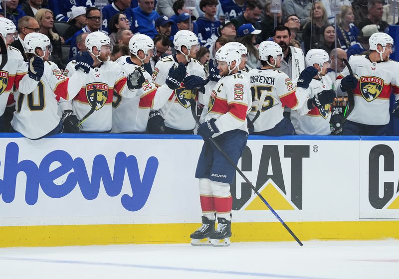 May 7, 2025; Toronto, Ontario, CAN; Florida Panthers center Aleksander Barkov (16) celebrates at the bench after scoring a goal against the Toronto Maple Leafs during the first period in game two of the second round of the 2025 Stanley Cup Playoffs at Scotiabank Arena. Mandatory Credit: Nick Turchiaro-Imagn Images