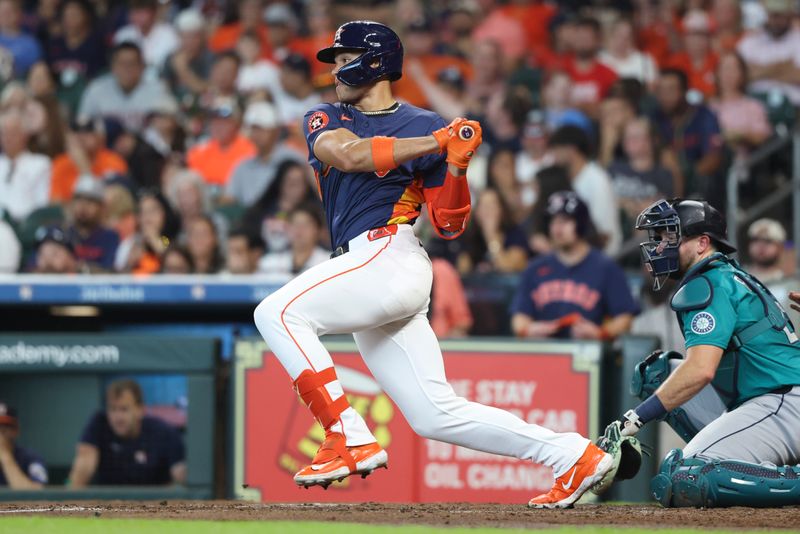 May 25, 2025; Houston, Texas, USA; Houston Astros right fielder Cam Smith (11) hits a single during the second inning against the Seattle Mariners at Daikin Park. Mandatory Credit: Troy Taormina-Imagn Images