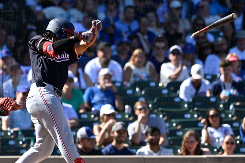 Sep 21, 2024; Chicago, Illinois, USA;  Washington Nationals third base José Tena (8) breaks his bat during the fourth inning against the Chicago Cubs at Wrigley Field. Mandatory Credit: Matt Marton-Imagn Images