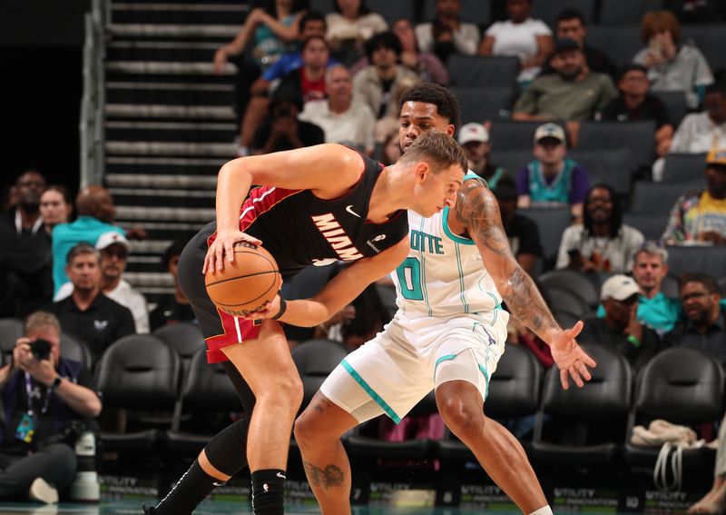 CHARLOTTE, NC - OCTOBER 8: Nikola Jovi #5 of the Miami Heat handles the ball during the game against the Charlotte Hornets during a preseason game on October 8, 2024 at Spectrum Center in Charlotte, North Carolina. NOTE TO USER: User expressly acknowledges and agrees that, by downloading and or using this photograph, User is consenting to the terms and conditions of the Getty Images License Agreement. Mandatory Copyright Notice: Copyright 2024 NBAE (Photo by Kent Smith/NBAE via Getty Images)