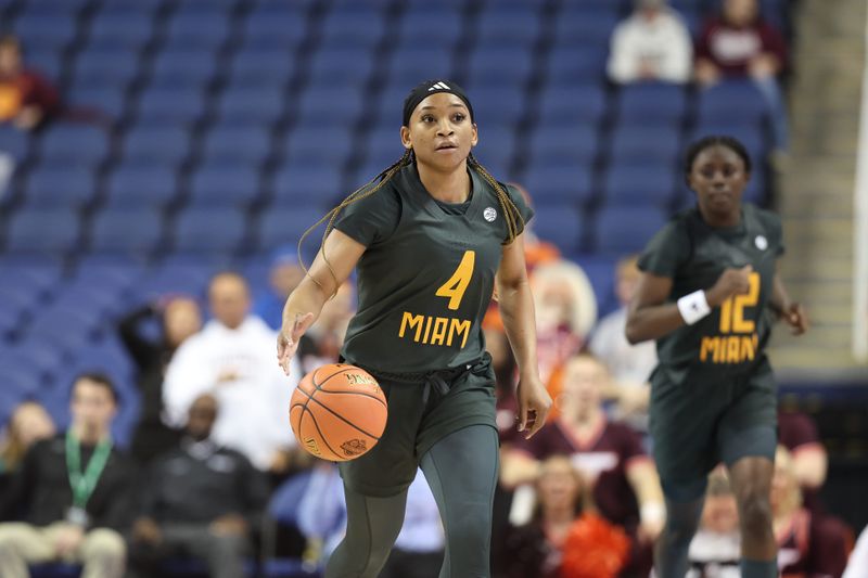 Mar 8, 2024; Greensboro, NC, USA; Miami Hurricanes guard Jasmyne Roberts (4) brings the ball up court in the second half against the Virginia Tech Hokies at Greensboro Coliseum. Mandatory Credit: David Yeazell-USA TODAY Sports