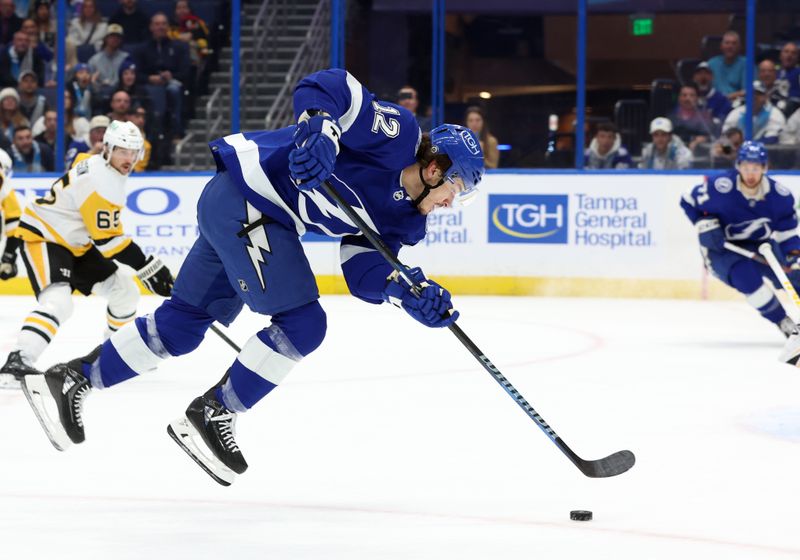 Dec 6, 2023; Tampa, Florida, USA; Tampa Bay Lightning center Alex Barre-Boulet (12) skates with the puck against the Pittsburgh Penguins during the first period at Amalie Arena. Mandatory Credit: Kim Klement Neitzel-USA TODAY Sports