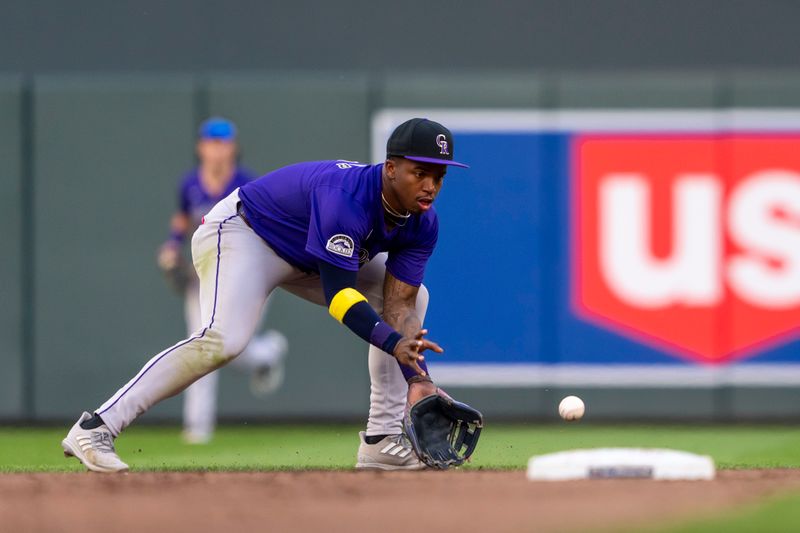Jun 11, 2024; Minneapolis, Minnesota, USA; Colorado Rockies second baseman Adael Amador (1) fields a ground ball against the Minnesota Twins in the sixth inning at Target Field. Mandatory Credit: Jesse Johnson-USA TODAY Sports