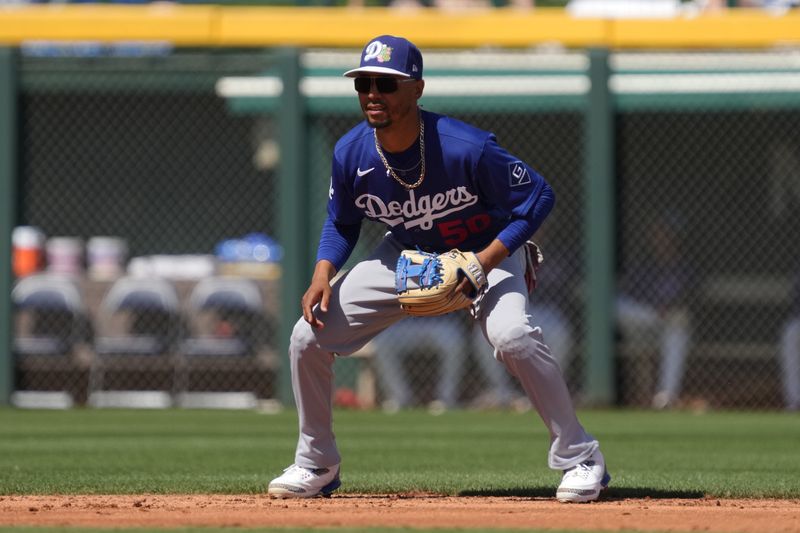 Mar 15, 2026; Mesa, Arizona, USA; Los Angeles Dodgers shortstop Mookie Betts (50) gets ready against the Chicago Cubs in the second inning at Sloan Park. Mandatory Credit: Rick Scuteri-Imagn Images